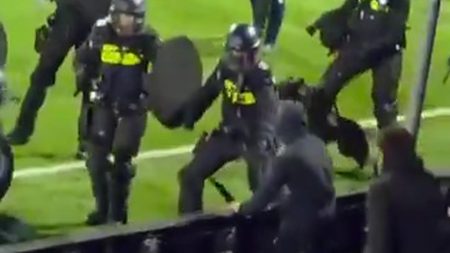 Cup clash descends into chaos after mass brawl with riot police and dogs forced to intervene