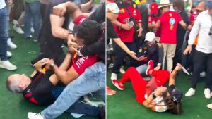 Huge brawl breaks out at Mexico GP with punches thrown and one man kicked on ground with beer sprayed everywhere
