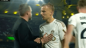 Moment furious Aberdeen star throws a strop when subbed in first half against AEK Athens as he pays price for mauling