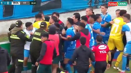 Police storm pitch and use tear gas to break up mass football fight as SEVEN players sent off Police storm pitch and use tear gas to break up mass football fight as SEVEN players sent off