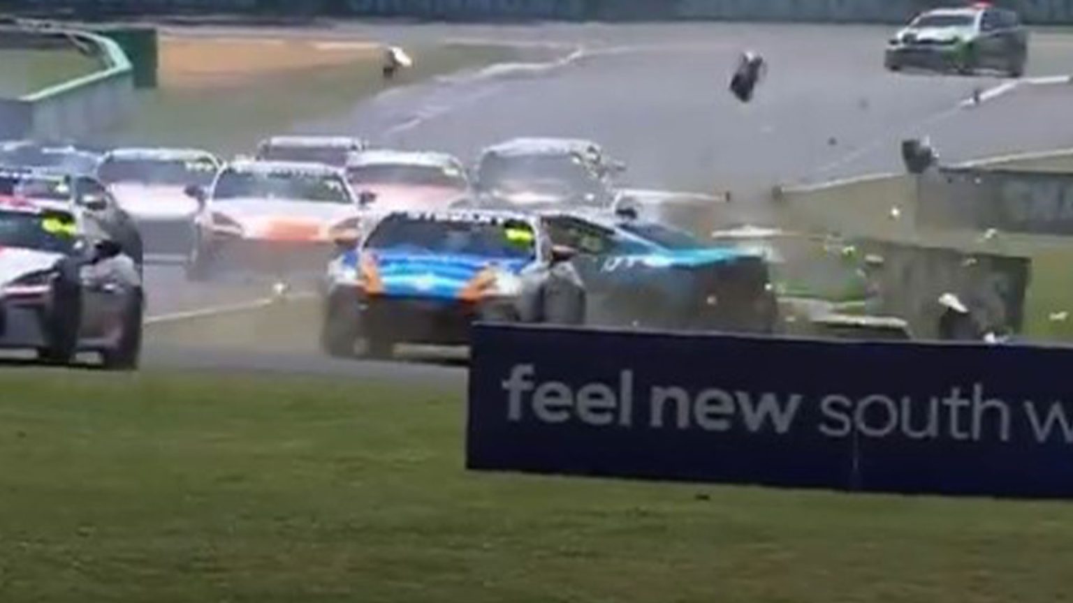 Race abandoned after horror crash during first lap sees legend’s son rushed to hospital with car ‘torn to pieces’