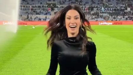 Stunning DAZN presenter forced to sprint off pitch in high heels as she nearly gets soaked by sprinker Stunning DAZN presenter forced to sprint off pitch in high heels as she nearly gets soaked by sprinker