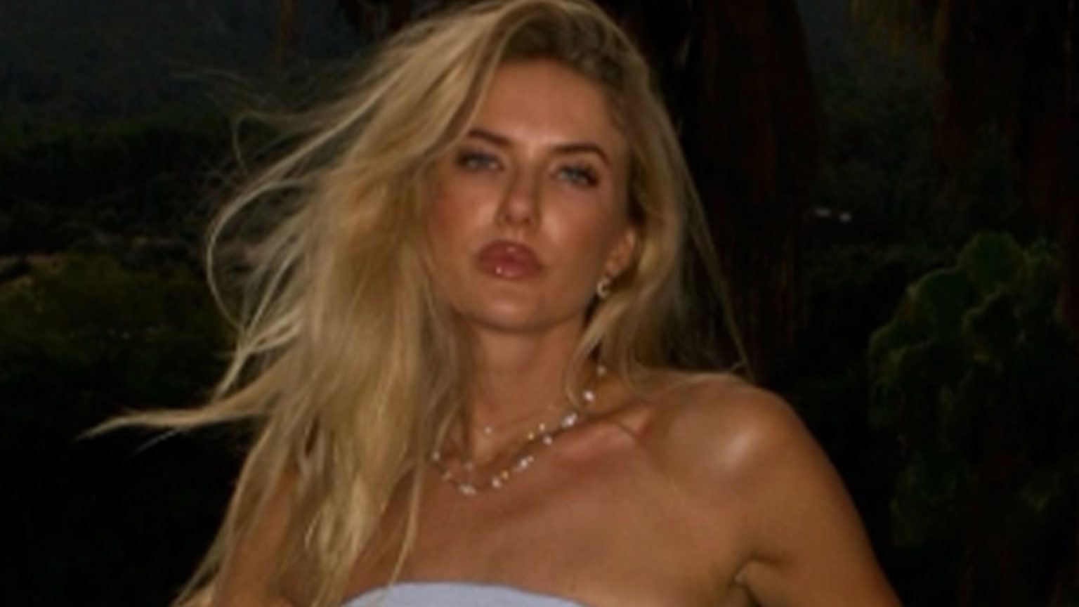 World’s sexiest athlete wows in bikini and summer dress in holiday photo dump as fans call her ‘unforgettably stunning’