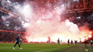 Ajax clash abandoned as huge fireworks display erupts in stands and referee unable to guarantee player safety