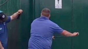 Awkward moment speedway star is trapped in TOILET with worker forced to use crowbar to break door open