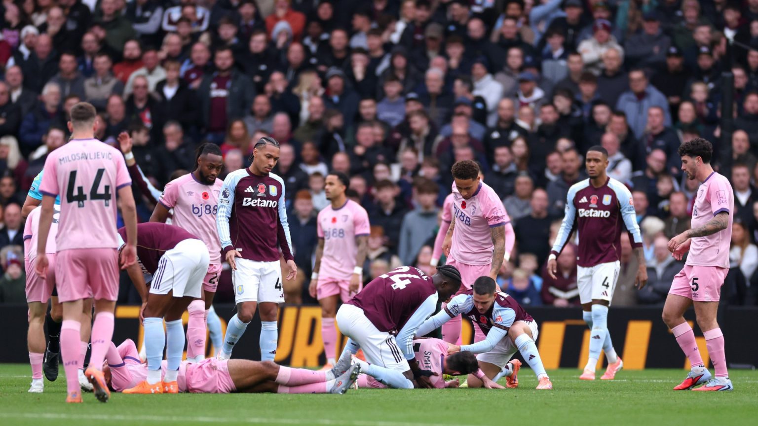 Bournemouth stars Tyler Adams and Adam Smith collapse to floor with nasty head injuries as Aston Villa clash suspended