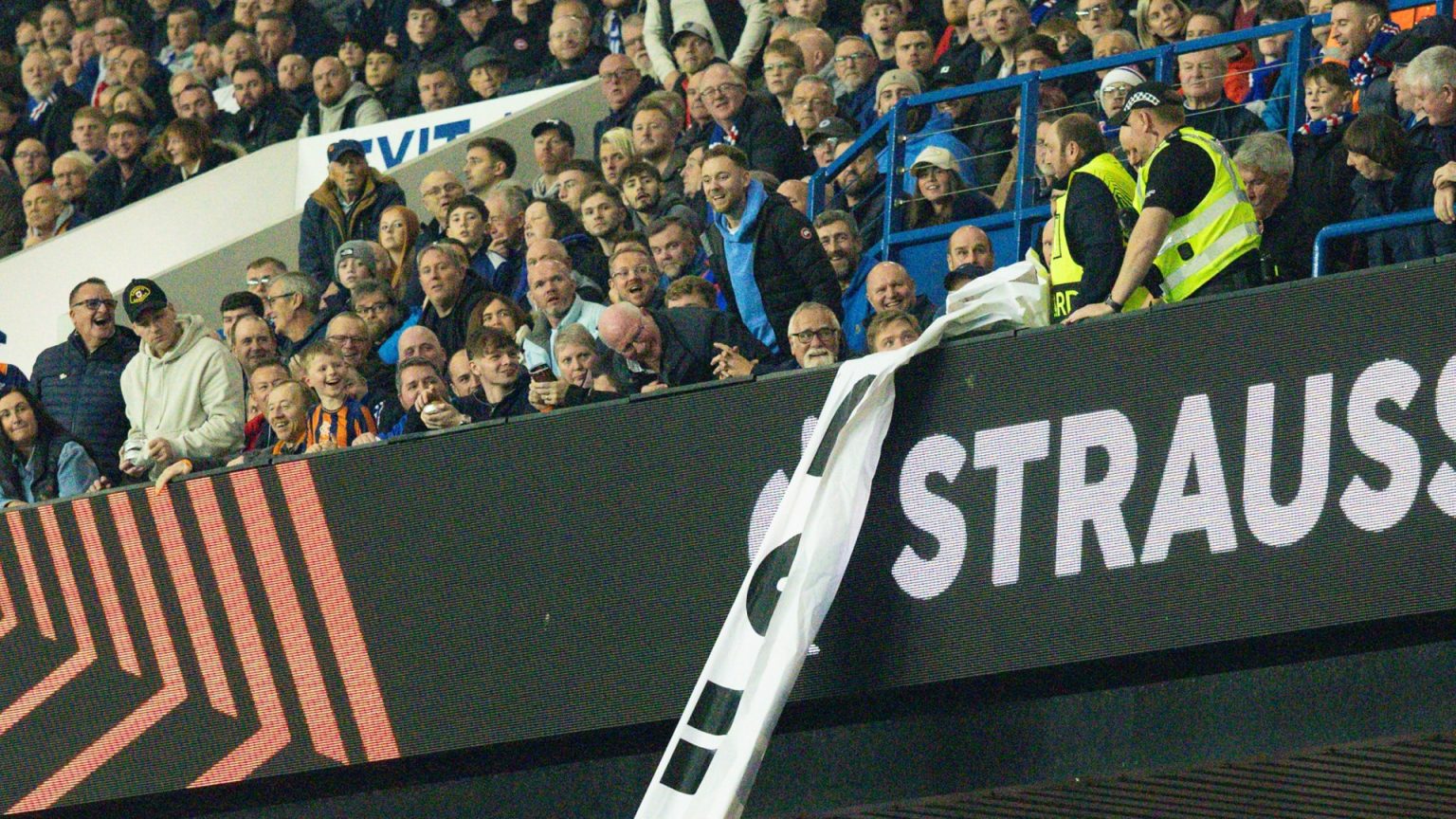 Moment Rangers fans snatch banner straight from steward’s hands after struggle before redisplaying it in stands