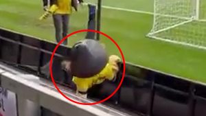 Moment stumbling non-league mascot appears to be ejected from stadium after falling over advertising hoardings