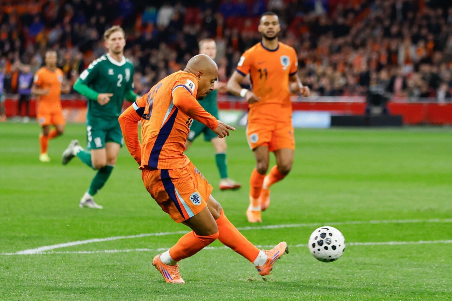Rapid-fire Oranje reach World Cup with 4-0 win over Lithuania