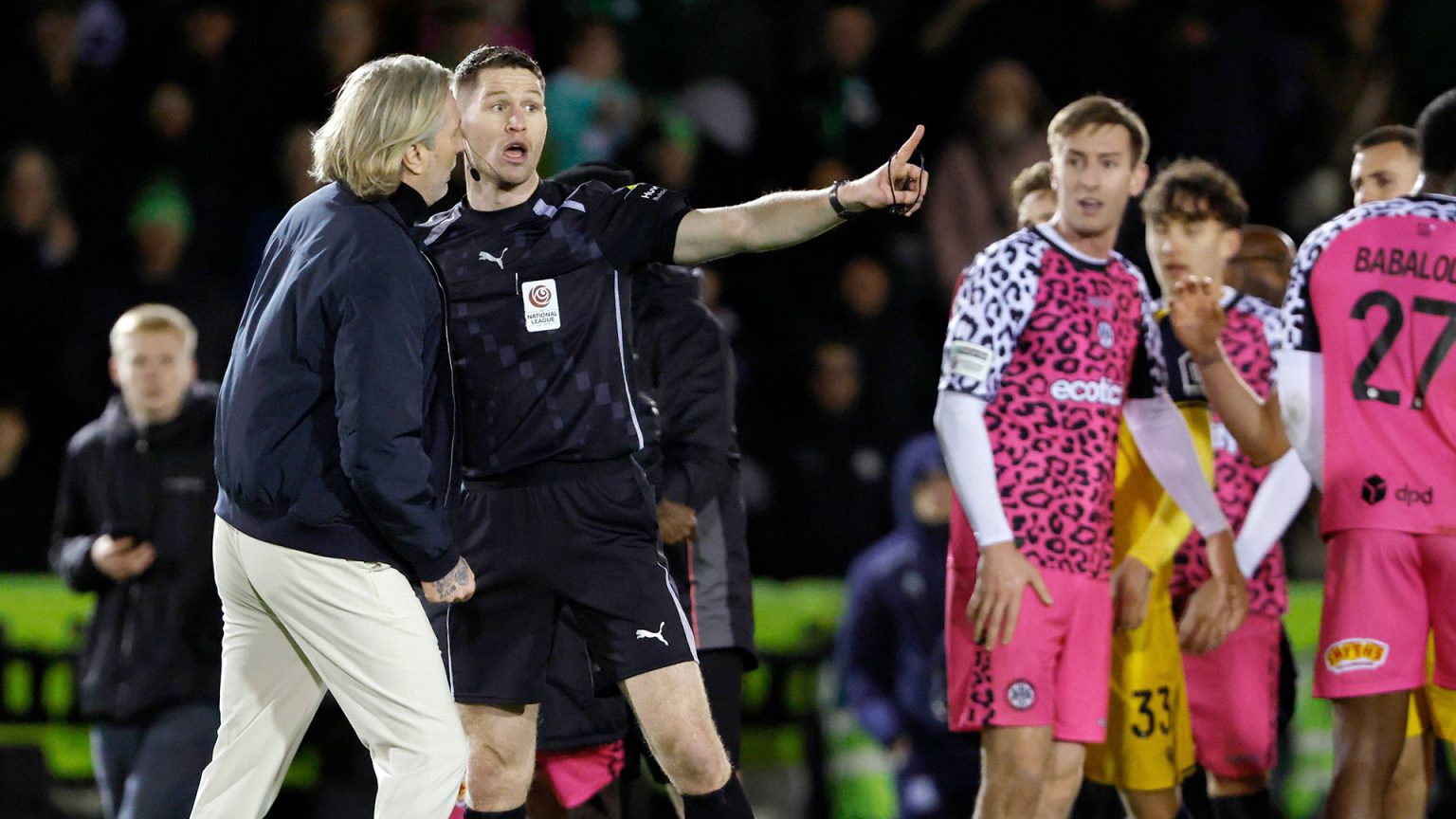 Robbie Savage ushered off pitch by referee and steward as mass brawl breaks out at the end of Forest Green clash