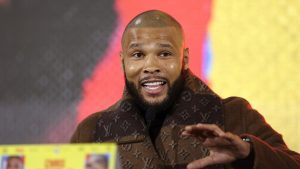 What is Chris Eubank Jr’s boxing record, and what titles has he won?