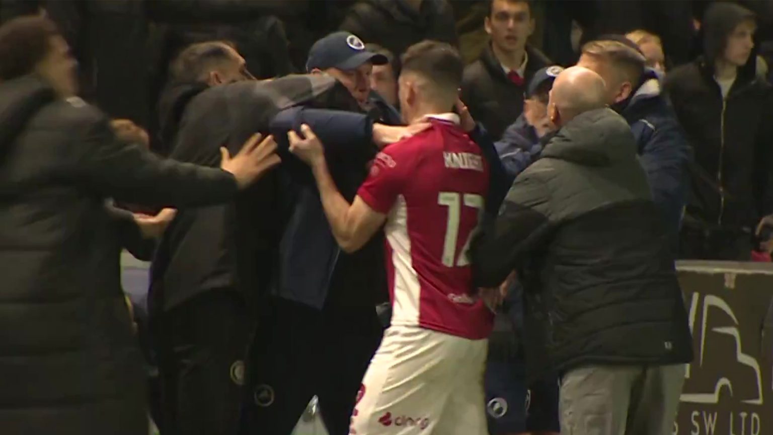 Shocking moment mass touchline brawl erupts in Championship clash as manager reveals ‘crazy’ reason for bust-up