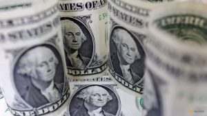 Dollar gains, traders shake off Venezuela to focus on US data flurry