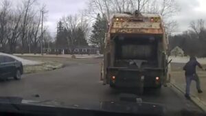 Sanitation worker surprised to find Huber Heights Police suspect in trash can